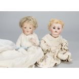 A Kestner 211 all-bisque character baby, with brown sleeping eyes, blonde mohair wig, bent-limbed