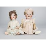 Two German character babies, a Schutzmeister & Quendt 201 with blue sleeping eyes, bent-limbed