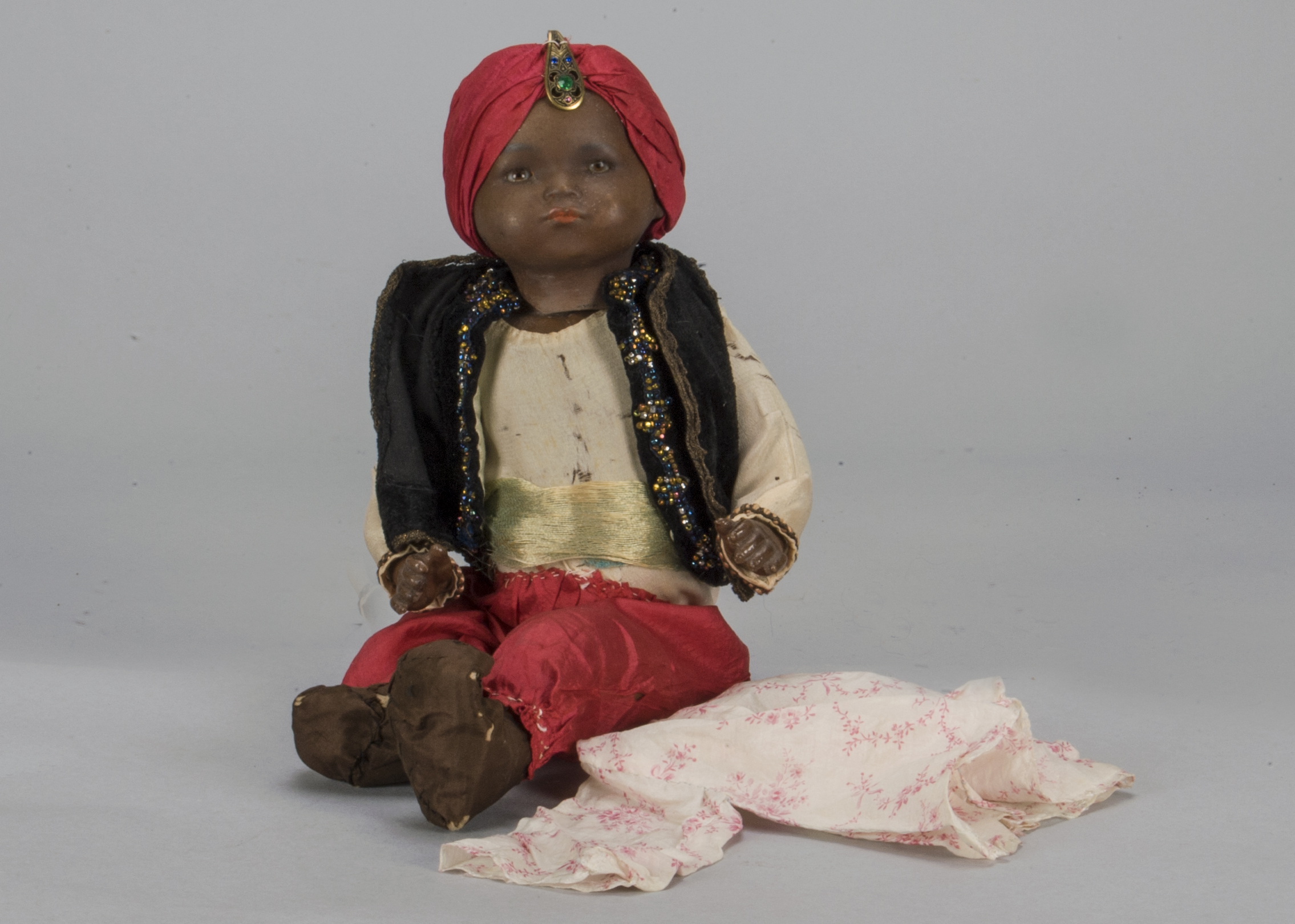 An Armand Marseille 341 black baby, with brown sleeping eyes, black painted hair, bent-limbed