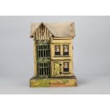 A German small wooden dolls’ house, cream, green and yellow painted with two storey usual full