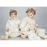 Two large Armand Marseille character baby dolls, one 990 and the other 995, both with brown sleeping