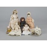 Six dolls’ house dolls, an Unis painted bisque head with composition body in black dress —5in. (12.