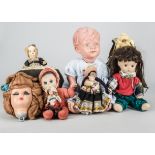 Various dolls, a Japanese air-blown boy doll —23in. (58.5cm.) high; a composition headed tea cosy; a