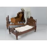 A mahogany doll’s half-tester bed, with green canopy —28in. (71cm.) long; a similar bed; and a