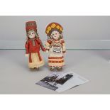Two German bisque headed dolls dressed in Russian costumes, mould numbers 448 and 532 with brown and