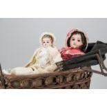 Two restored bisque headed dolls, a L V France child doll with jointed body, white cotton dress,