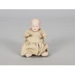 A very small Alt Beck & Gottschalck 1323 character baby, with brown painted eyes, open/closed mouth,