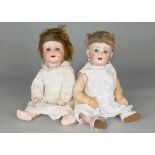 Two German character baby dolls, a Kammer & Reinhardt 22 baby with blue sleeping eyes, blonde mohair