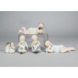 German bisque children with their pets, a small figural group of two seated children holding a