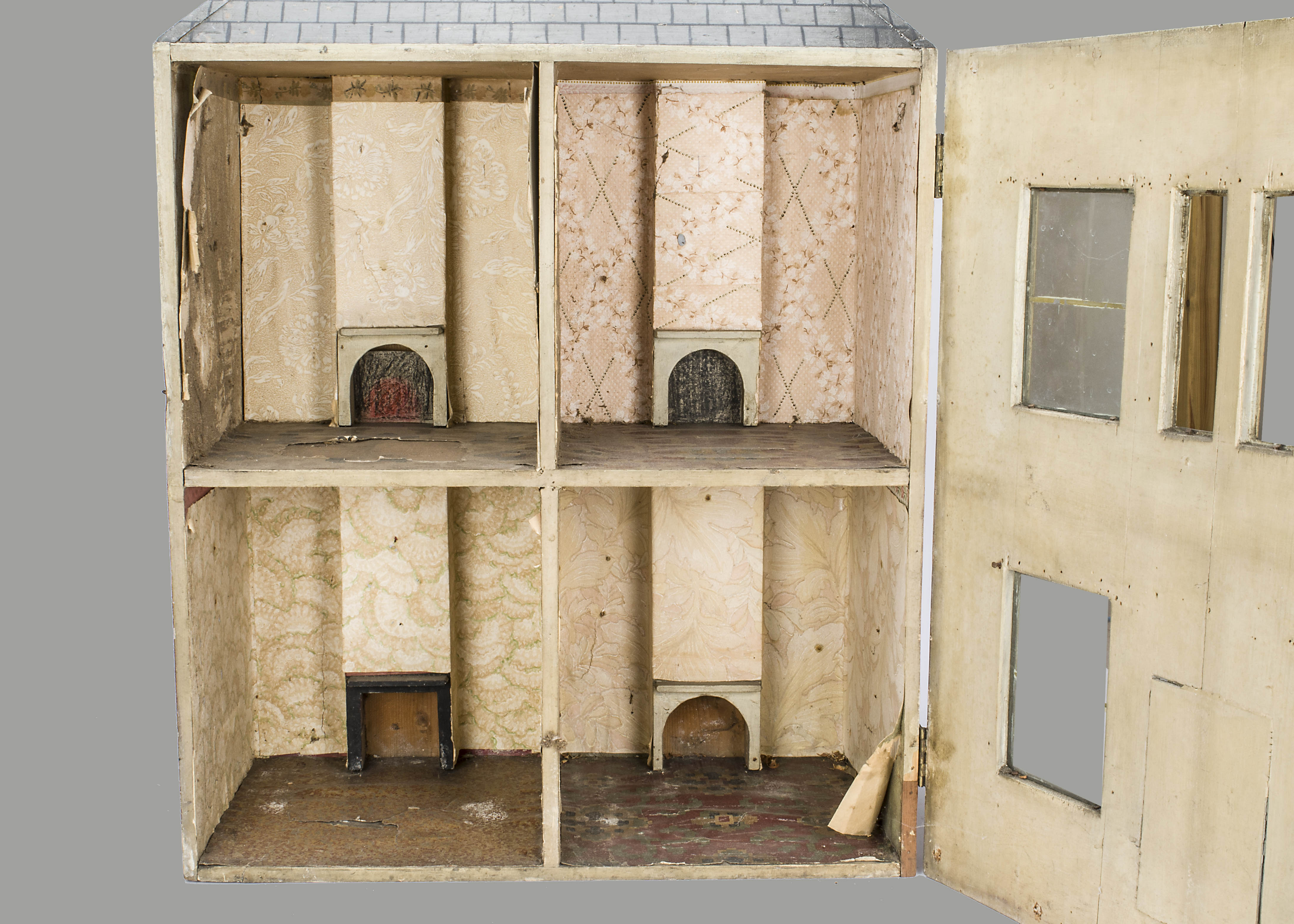 A painted wooden dolls’ house, the painted stone and brick facade with central dummy front door with - Image 2 of 2