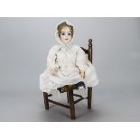 An Armand Marseille DEP child doll, with blue sleeping eyes, dark glazed brows, blonde mohair wig,