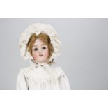 A large Simon & Halbig for Heinrich Handwerck child doll, with brown sleeping eyes, pierced ears,