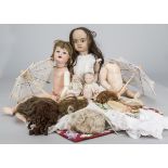 Dolls spares and clothes, a few old wigs, a lightly tanned probably reproduction Jumeau head, AM 996