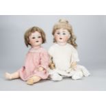 Two German character babies, a Schutmeister & Quendt 201 with blue sleeping eyes, bent-limbed