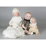 Three Armand Marseille babies, two 351 with blue sleeping eyes, blonde painted hair and bent-