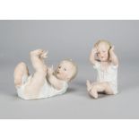 Two seated Gebruder Heubach babies, one reclining with limbs in the air —8½in. (22cm.) long; and