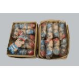 Two trade boxes of Czechoslovakian rubber boy squeak toys, eight in one box and seven in the