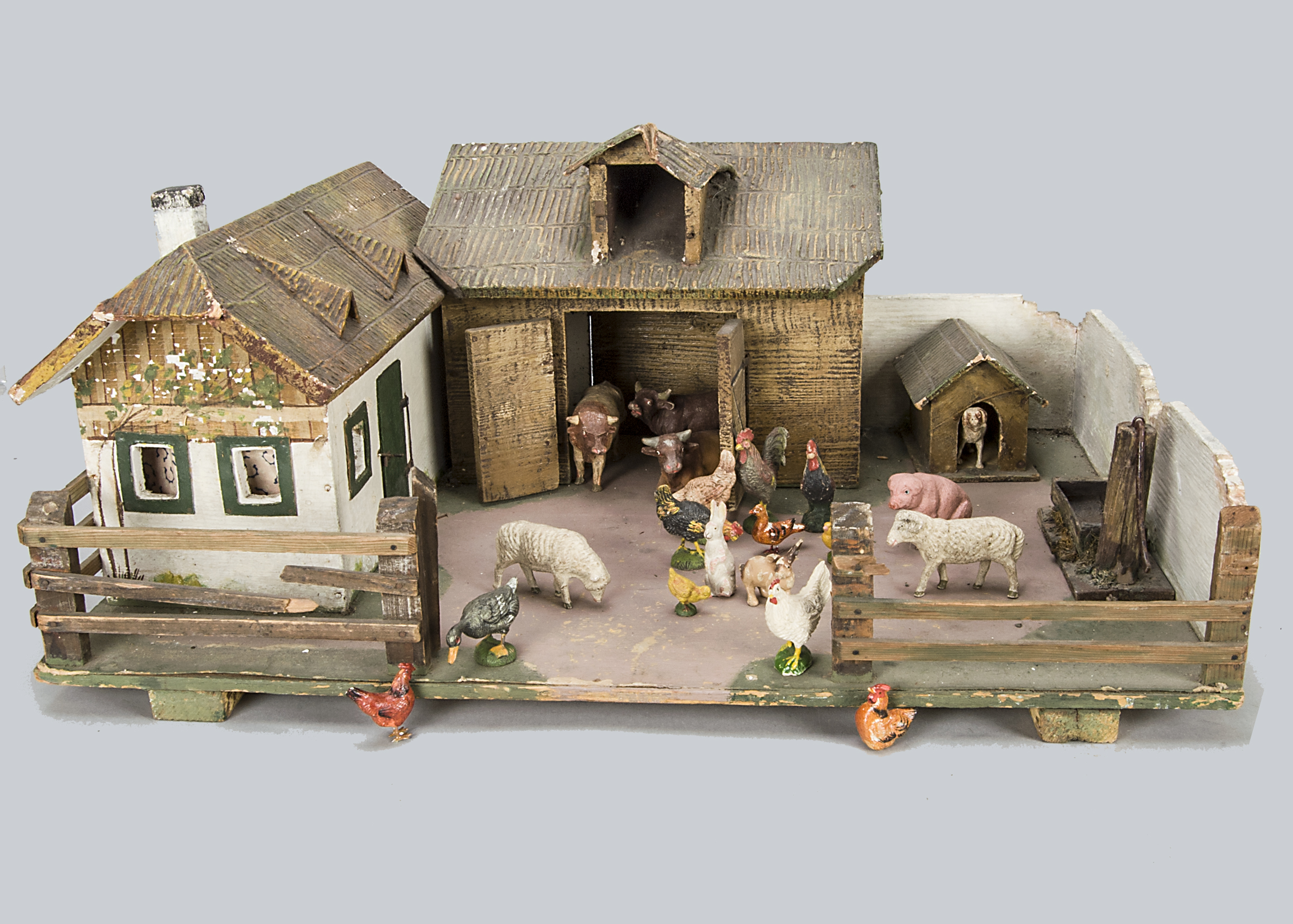 A Tipple-Topple farm yard, with painted wooden farm house, barn and kennel with composition textured