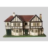 A large Tri-ang stockbroker dolls’ house No 93, mock Tudor design, half timbered and cream