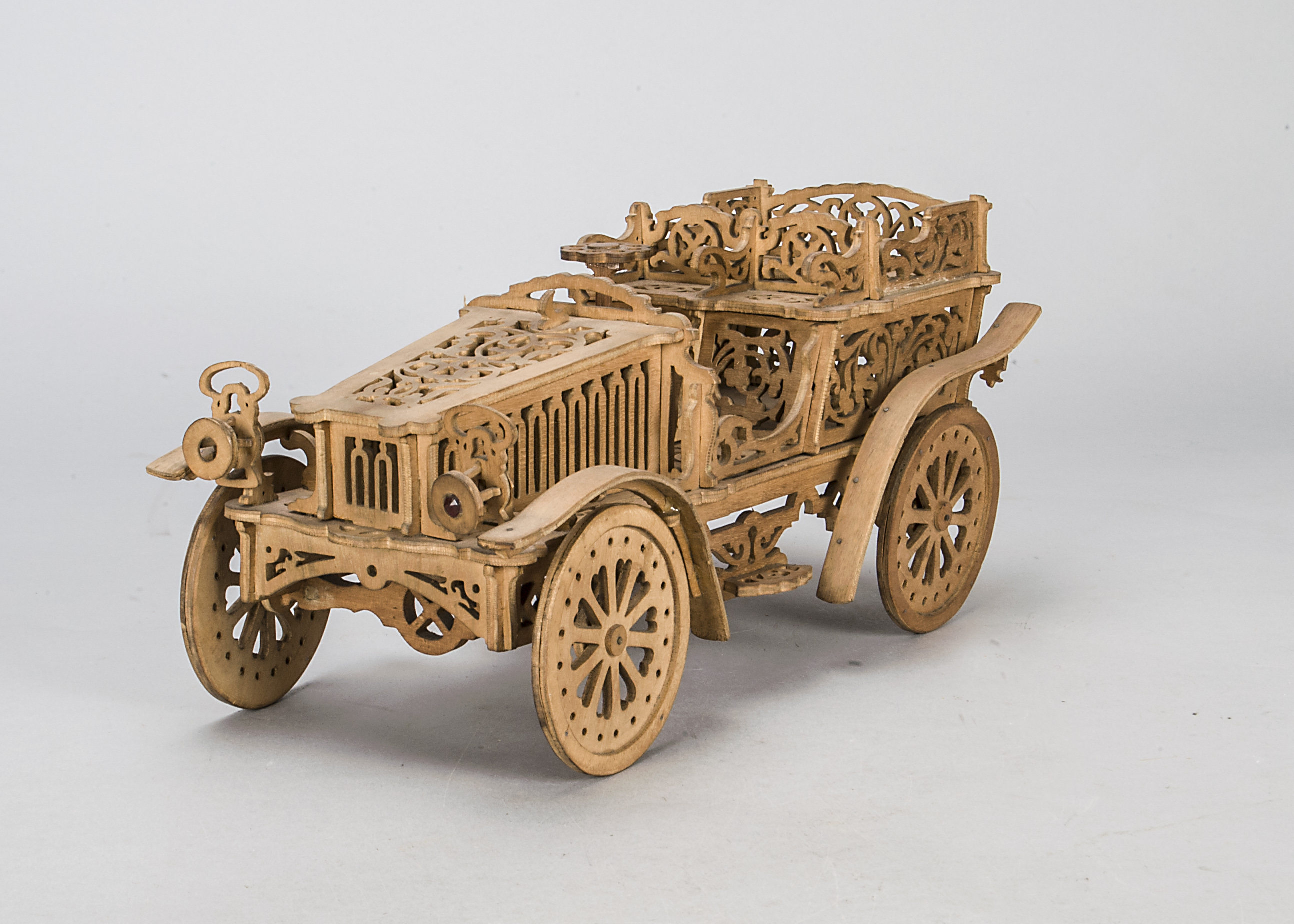 An unusual fretwork four seat open tourer, early 20th century with steering mechanism —15½in. (39.