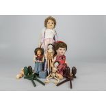 Various dolls, a pegged wooden doll —10in. (25.5cm.) high, another turned into a puppet, an