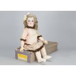 A large Simon & Halbig for Kammer & Reinhardt child doll, with blue sleeping eyes, blonde mohair