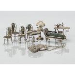 White metal filigree dolls’ house furniture, probably Chinese including chaise longue with blue