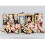 A large quantity of British hard plastic dolls, eight Roddy walking dolls, seven in original blue