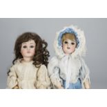 Two French child dolls, a SFBJ 60 with dark sleeping eyes, blonde mohair wig, jointed papier-mâché