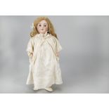 A S.F.B.J. 301 child doll, with brown lashed sleeping eyes, blonde hair wig, jointed papier-mâché