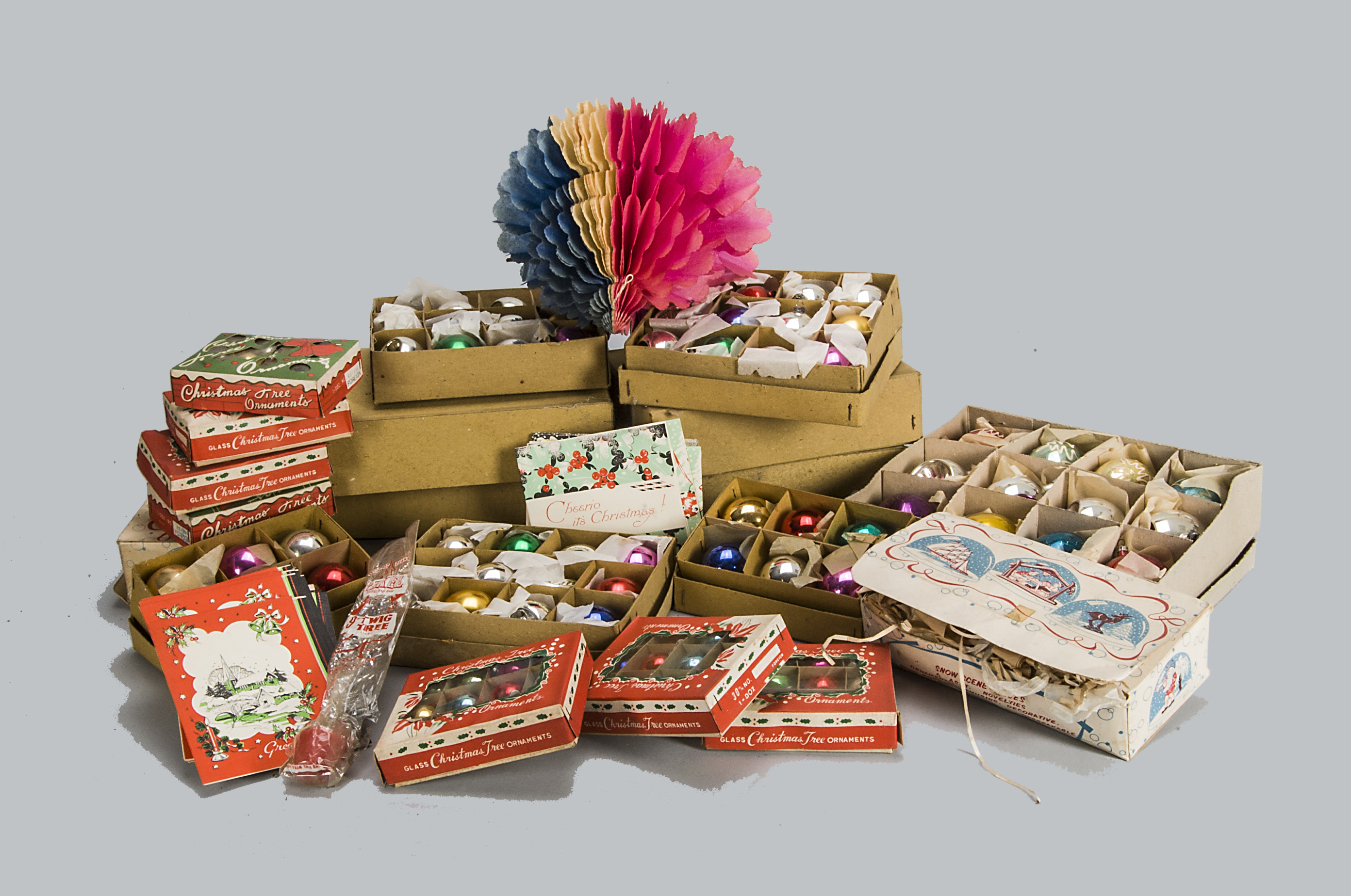 A quantity of Christmas decorations, a large quantity of mainly plain baubles in card packing boxes,