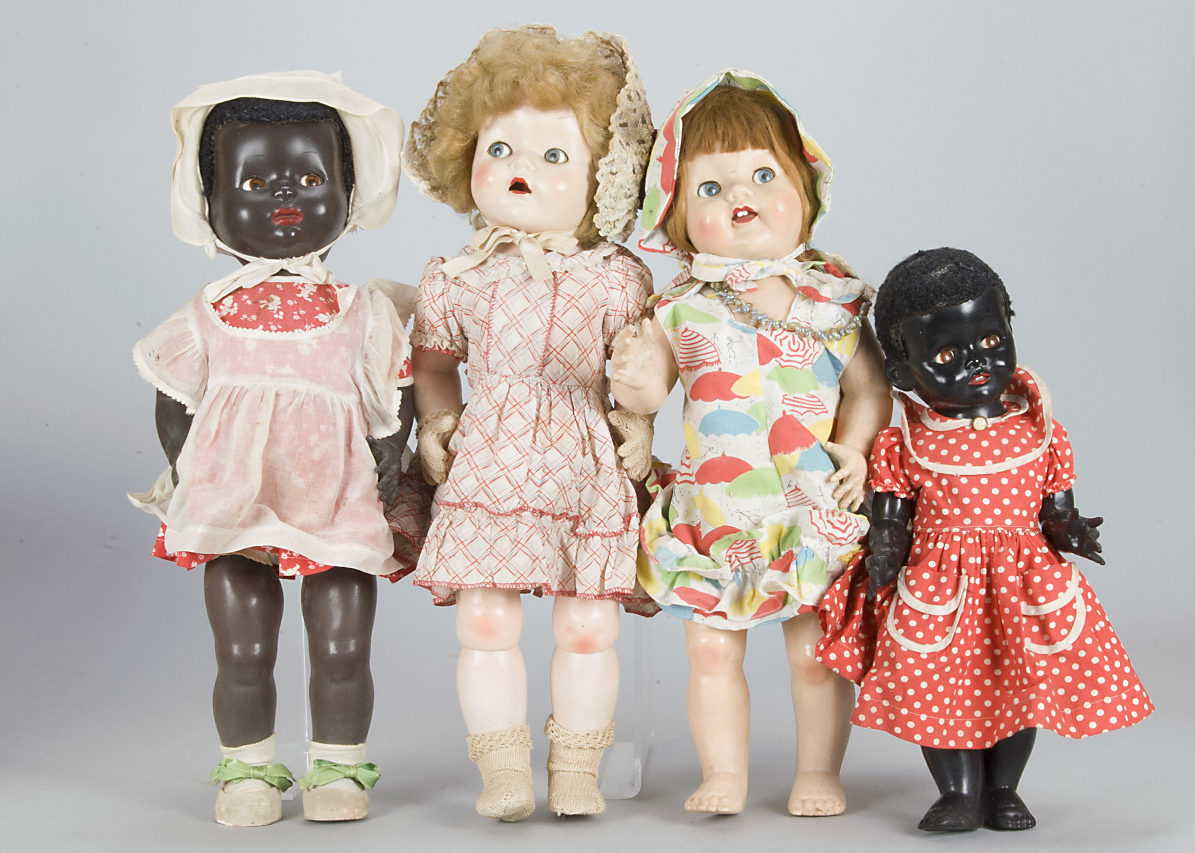 Four British hard plastic dolls, two Pedigree walking and talking dolls (the one in checks with