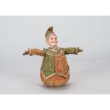 A Mr Punch roly poly toy, with composition painted head, red and green felt costume with matching