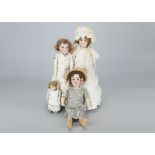 Four German child dolls, an AM Floradora shoulder-head; a Recknagel, a damaged W over anchor mark