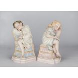 A rare pair of painted Parian sculptures of sleeping children by R J Morris, each reclining on a
