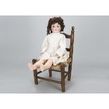 A Kestner 182 child doll, with blue sleeping eyes, modern nylon wig, jointed composition body and