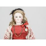 A Bru smiling fashionable doll, with pressed bisque head marked E with blue glass striated eyes,