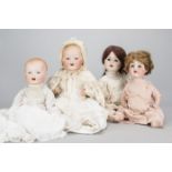 Four German character babies, an AM 352 with blue sleeping eyes, blonde painted hair, jointed