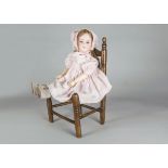 A German bisque headed child doll marked G B, probably George Borgfeldt with brown lashed sleeping