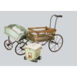 A child’s three wheeled hand cart, the slatted sides painted green and red with metal wheels —