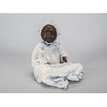 An Ernst Heubach 399 bisque headed black character baby, with brown sleeping eyes, full-lipped