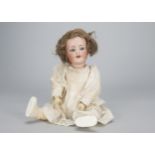 A Kammer & Reinhardt 126 toddler, with blue sleeping eyes, brown mohair wig, jointed composition