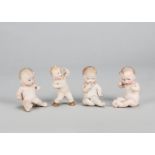 Four small Gebruder Heubach naked babies, two grumpy, one coy and the other standing distressed