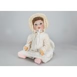 A large Schoenau & Hoffmeister Hanna baby, with blue lashed sleeping eyes, brown mohair wig, bent-