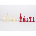 A complete set of early 20th Century bone chess pieces, dyed red and in natural versions, height