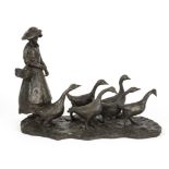 A resin figure of a young girl and geese, measurements approximately 52cmx 32cm x 25cm