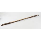 An Auca Indian bow and three arrows, one with domed head for stunning birds, length 126 cm