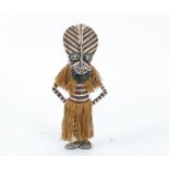 An African tribal figure with skirt, height 36 cm