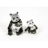 A Swarovski crystal 'Endangered Panda' pair, designed by Heinz Tabertshofer, with the original box