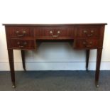 A late 19th/early 20th Century kneehole bow fronted writing desk, with one central long drawer and